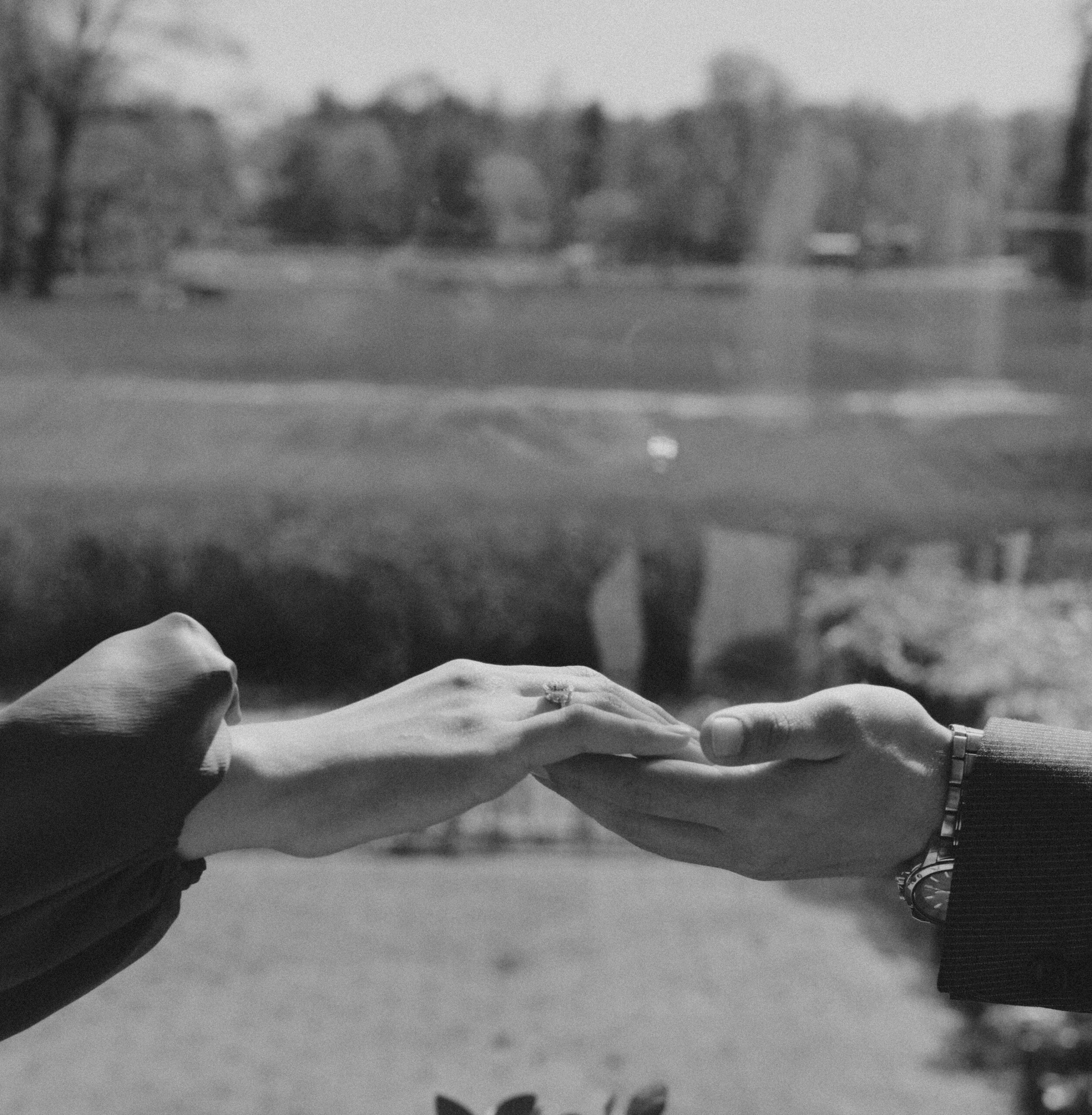 Two hands reaching toward each other